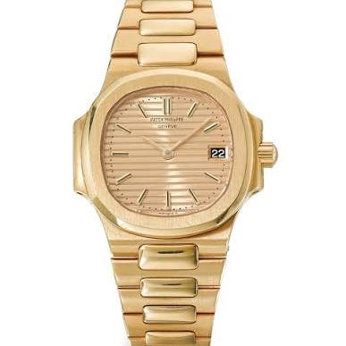 Gold wristwatch with a white background