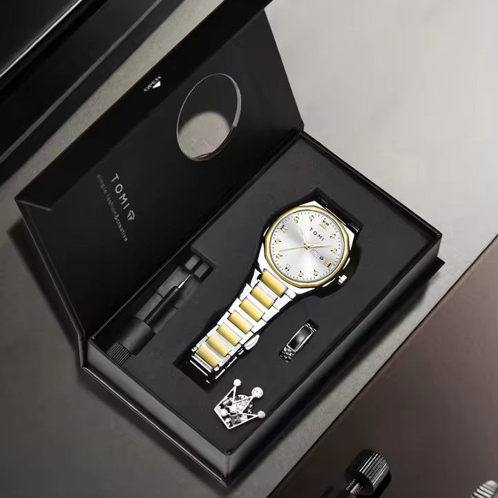Gold watch with white face in a black box on a gray surface